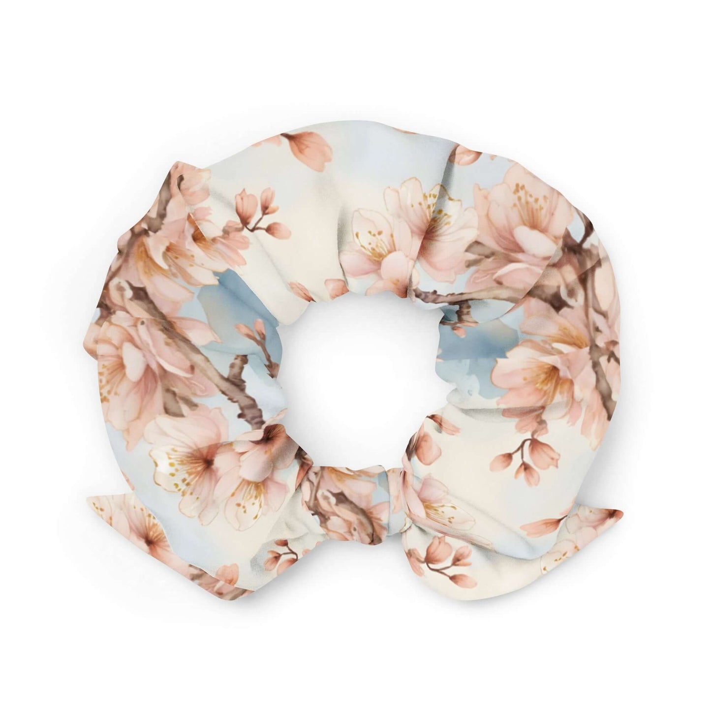 Recycled fabric scrunchie with pink cherry blossom floral print on white background