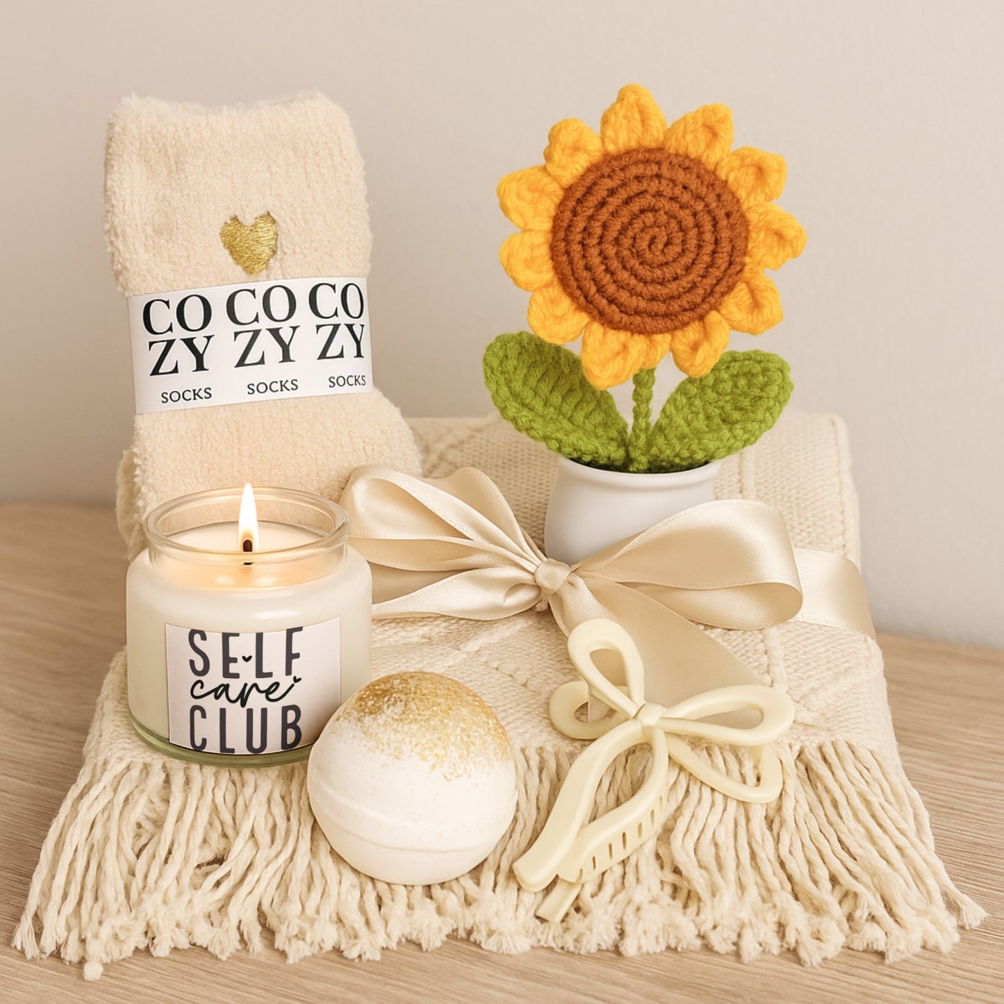 Self Care Club Candle & Sunflower Gift Set with cozy socks, decorative sunflower, bath bomb, and hair clip.